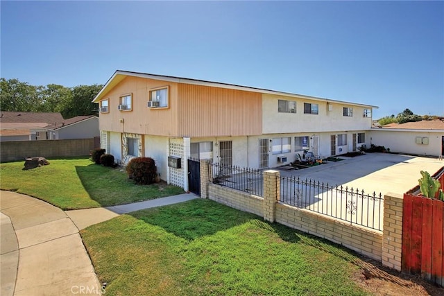 673 S Eremland Dr, Covina, CA 91723 - view of property with a patio area, stucco siding, fence private yard, and a front lawn