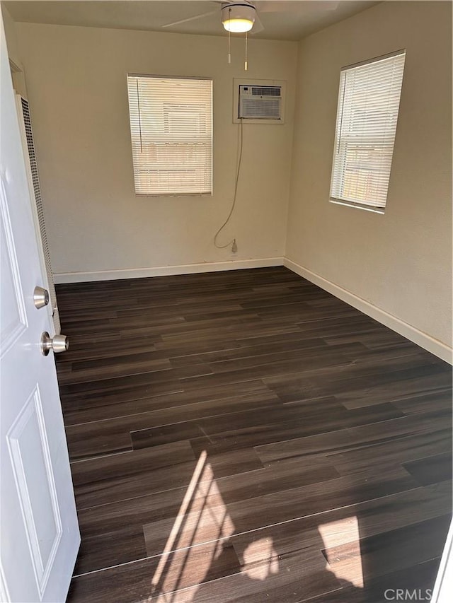 180 S 2nd Ave, Upland, CA 91786 - empty room with a wall unit AC, dark wood-style floors, and a ceiling fan