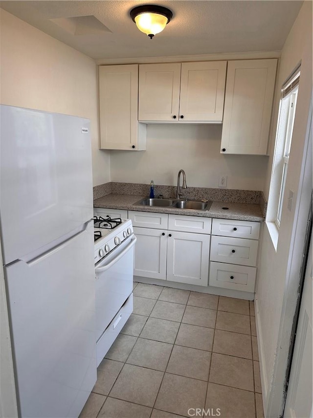 180 S 2nd Ave, Upland, CA 91786 - kitchen with white appliances, white cabinets, and light tile patterned floors