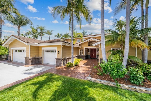 753 Jacquelene Ct, Encinitas, CA 92024 - view of front facade featuring brick siding, concrete driveway, a garage, and a front yard