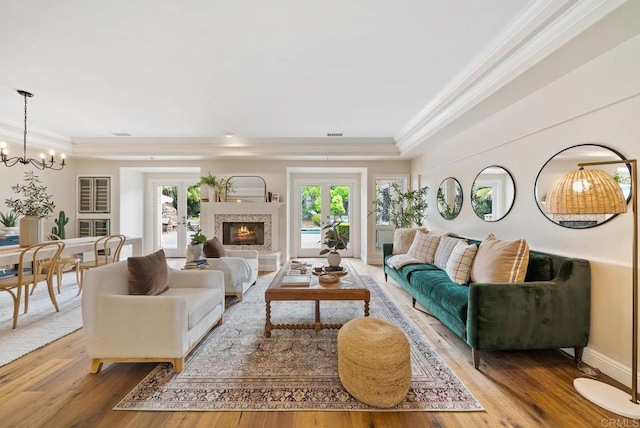 753 Jacquelene Ct, Encinitas, CA 92024 - living area with a chandelier, healthy amount of natural light, crown molding, and light wood-style flooring