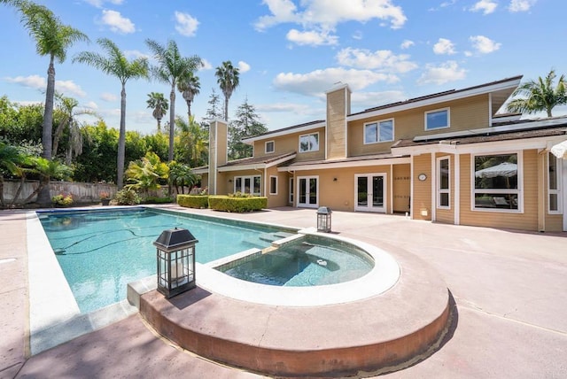 753 Jacquelene Ct, Encinitas, CA 92024 - view of swimming pool featuring french doors, a pool with connected hot tub, a patio, and fence