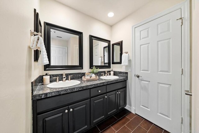 753 Jacquelene Ct, Encinitas, CA 92024 - bathroom featuring double vanity and baseboards