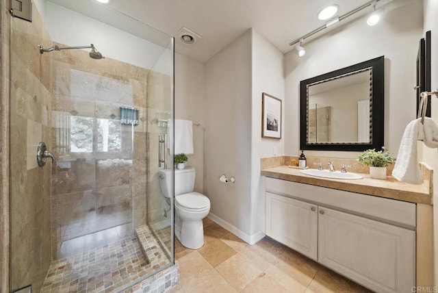 753 Jacquelene Ct, Encinitas, CA 92024 - bathroom featuring toilet, a stall shower, vanity, tile patterned floors, and rail lighting