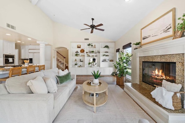753 Jacquelene Ct, Encinitas, CA 92024 - living room with a ceiling fan, a premium fireplace, decorative columns, high vaulted ceiling, and light wood-type flooring