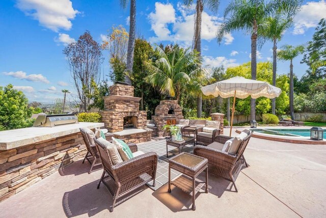 753 Jacquelene Ct, Encinitas, CA 92024 - view of patio featuring an outdoor stone fireplace and grilling area