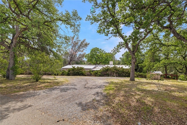 exterior space featuring gravel driveway