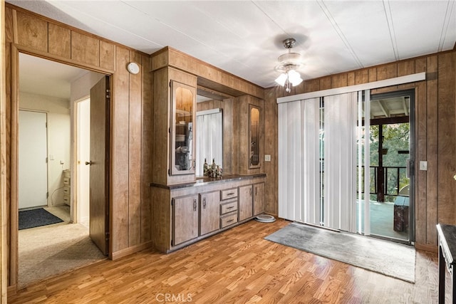 7395 Cardinal Rd, Corning, CA 96021 - entrance foyer featuring wooden walls, light wood-style flooring, and a ceiling fan