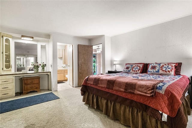 carpeted bedroom with ensuite bath
