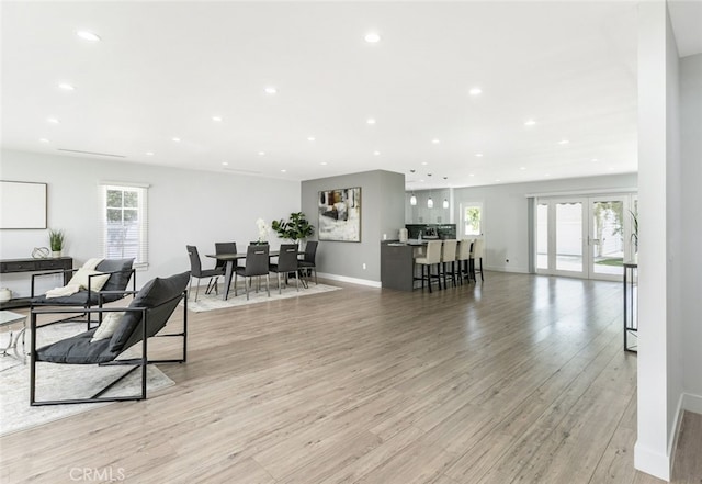 1430 Irving Ave, Glendale, CA 91201 - living room featuring a wealth of natural light, recessed lighting, light wood-style floors, and baseboards