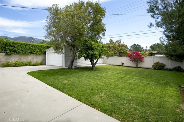 1430 Irving Ave, Glendale, CA 91201 - view of yard with a mountain view, an outbuilding, a fenced backyard, and a garage