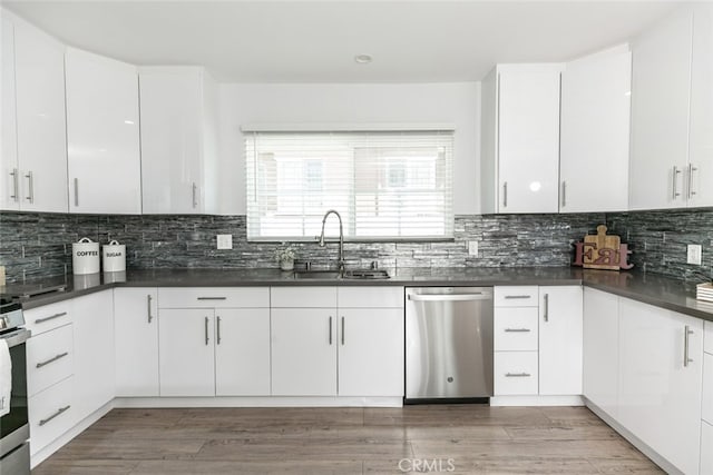 1430 Irving Ave, Glendale, CA 91201 - kitchen featuring a sink, dark countertops, white cabinetry, and stainless steel appliances