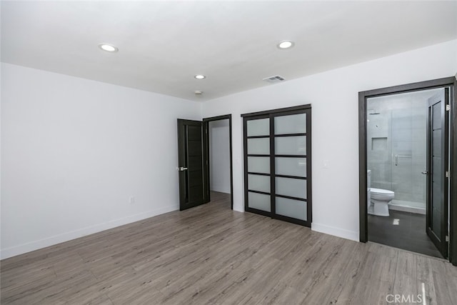 1430 Irving Ave, Glendale, CA 91201 - unfurnished bedroom featuring ensuite bath, visible vents, recessed lighting, light wood finished floors, and baseboards