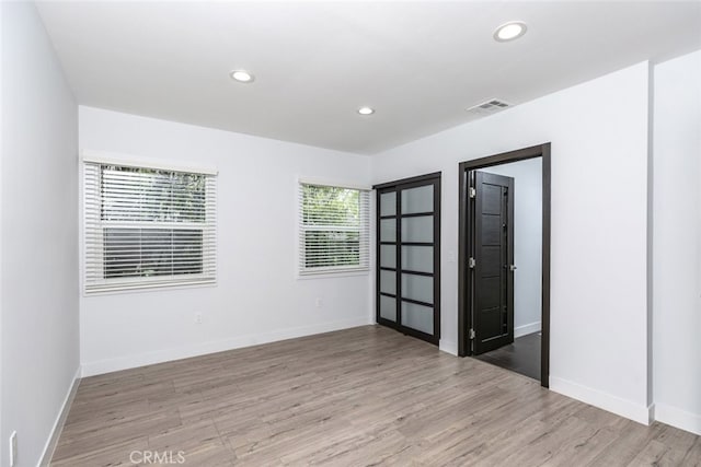1430 Irving Ave, Glendale, CA 91201 - empty room featuring recessed lighting, visible vents, baseboards, and wood finished floors