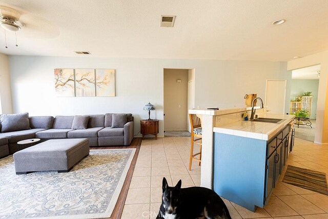 43564 Amazon St, Hemet, CA 92544 - living room featuring light tile patterned flooring and ceiling fan