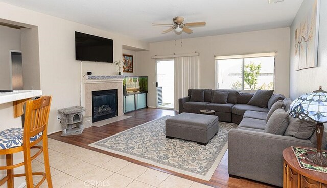 43564 Amazon St, Hemet, CA 92544 - living room featuring ceiling fan, a tiled fireplace, and tile patterned flooring