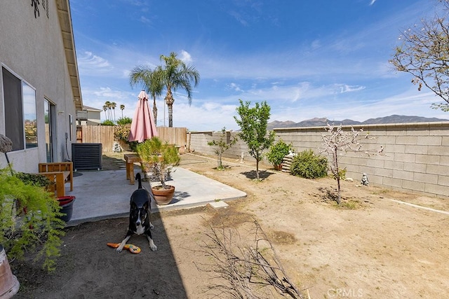 43564 Amazon St, Hemet, CA 92544 - fenced backyard featuring a patio area, cooling unit, and a mountain view