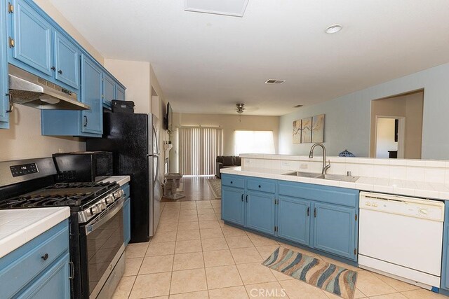 43564 Amazon St, Hemet, CA 92544 - kitchen with stainless steel range with gas stovetop, dishwasher, a sink, and blue cabinets