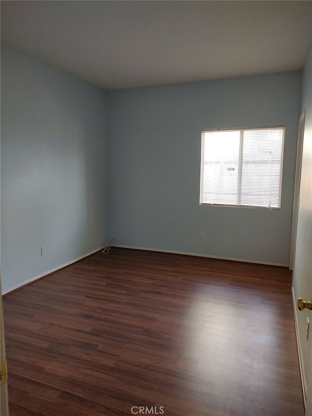 43564 Amazon St, Hemet, CA 92544 - unfurnished room with dark wood-style floors and baseboards