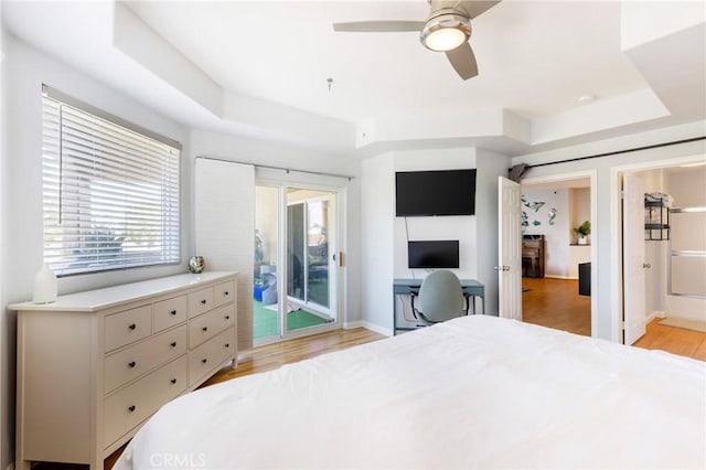 1180 Civic Center Dr Unit B21, Oceanside, CA 92054 - bedroom featuring a tray ceiling, access to outside, light wood finished floors, and a ceiling fan