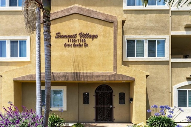 1180 Civic Center Dr Unit B21, Oceanside, CA 92054 - view of exterior entry featuring stucco siding