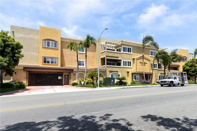 1180 Civic Center Dr Unit B21, Oceanside, CA 92054 - view of property featuring a garage