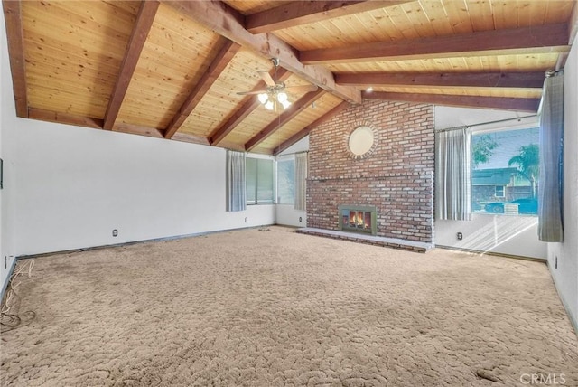 additional living space featuring wood ceiling, a ceiling fan, a brick fireplace, and a wealth of natural light
