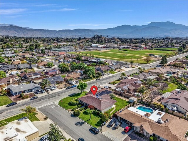 birds eye view of property with a mountain view and a residential view
