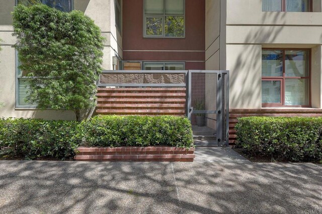 1150 J St Unit 117, San Diego, CA 92101 - doorway to property with stucco siding