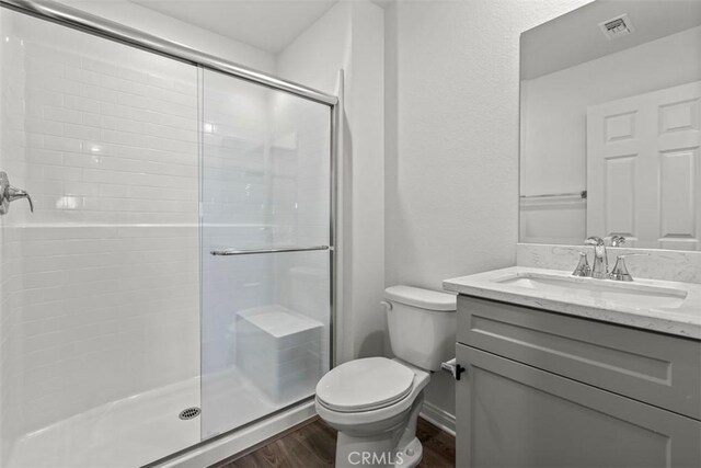 4265 S Hermosa Paseo, Ontario, CA 91761 - full bath with a shower stall, vanity, visible vents, toilet, and wood finished floors