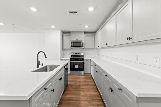 4265 S Hermosa Paseo, Ontario, CA 91761 - kitchen with recessed lighting, visible vents, a center island with sink, appliances with stainless steel finishes, and a sink