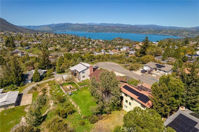 aerial view featuring a water and mountain view