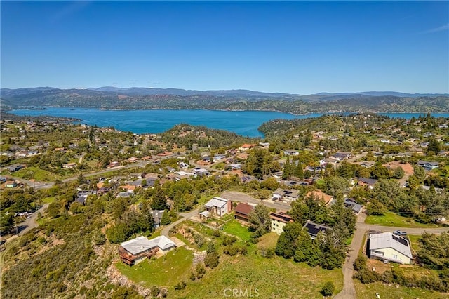 aerial view featuring a water and mountain view and a residential view