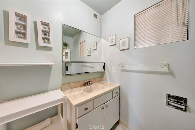 bathroom with visible vents and vanity