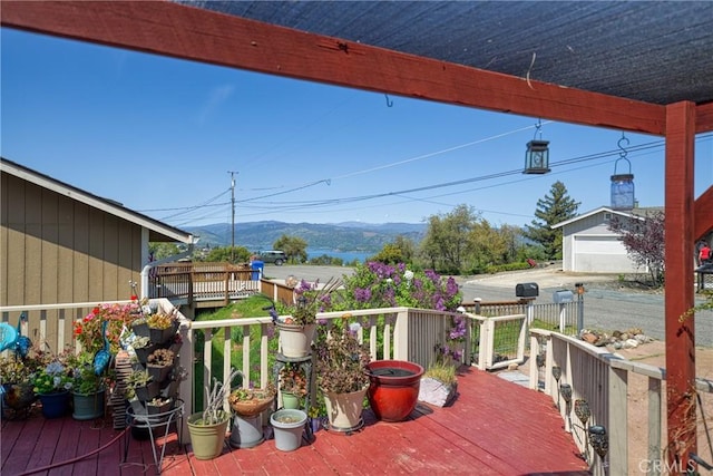 wooden deck with a garage
