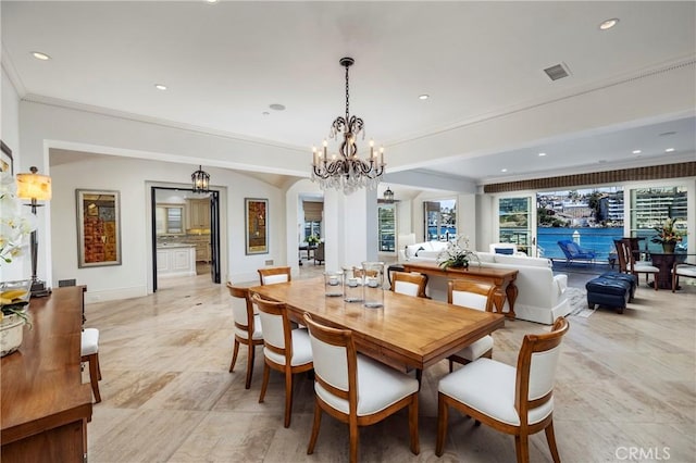 2258 Channel Rd, Newport Beach, CA 92661 - dining area with a chandelier, crown molding, arched walkways, recessed lighting, and baseboards