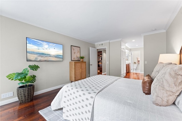bedroom featuring crown molding, baseboards, recessed lighting, hardwood / wood-style flooring, and ensuite bath
