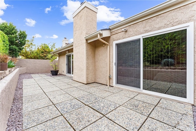 view of patio featuring fence