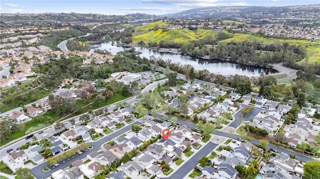 birds eye view of property with a residential view and a water view