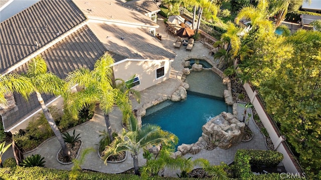 aerial view featuring a garden pond