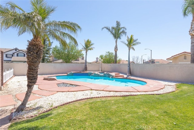 view of pool with a fenced in pool, a yard, and a fenced backyard
