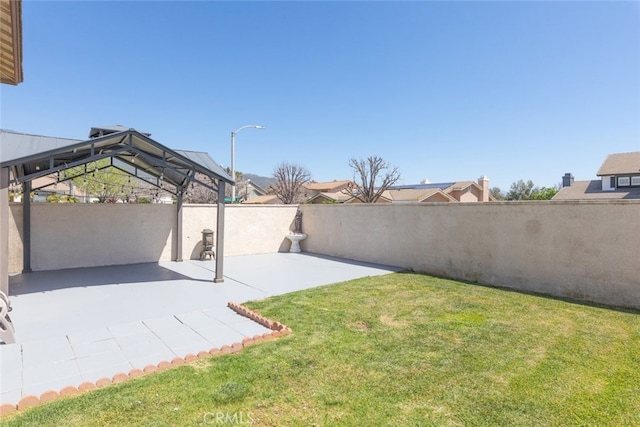 view of yard featuring a gazebo, a patio area, and fence