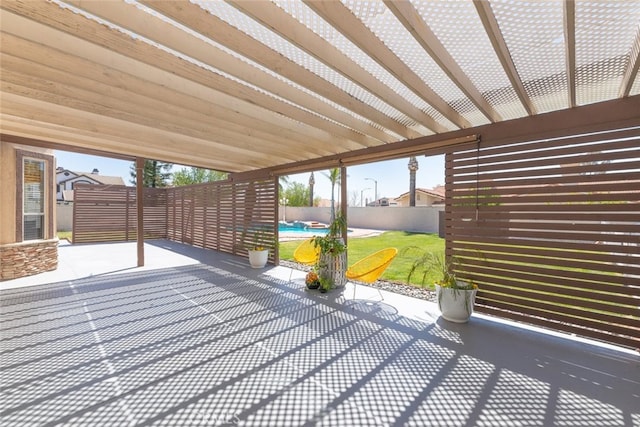 exterior space featuring a pergola, a patio area, a pool, a yard, and fence