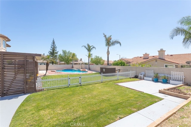 view of yard with a fenced in pool, a patio area, and fence