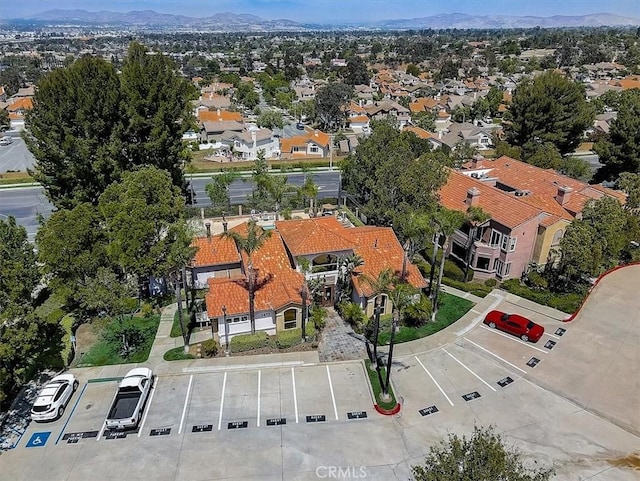 birds eye view of property with a mountain view and a residential view