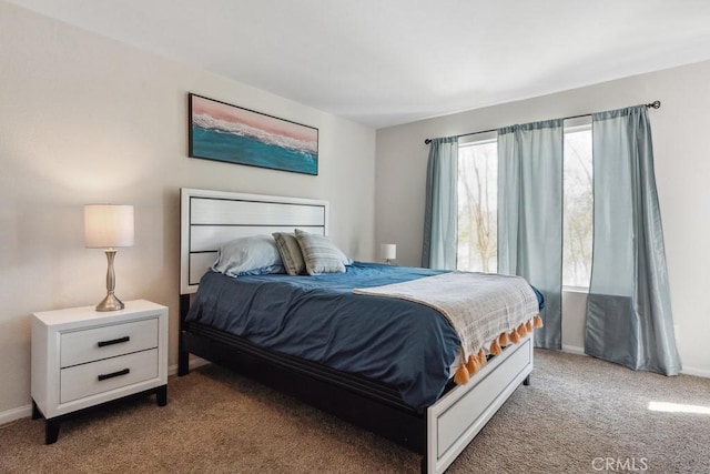 carpeted bedroom with baseboards