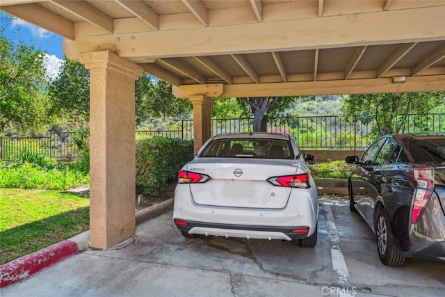 covered parking lot with fence