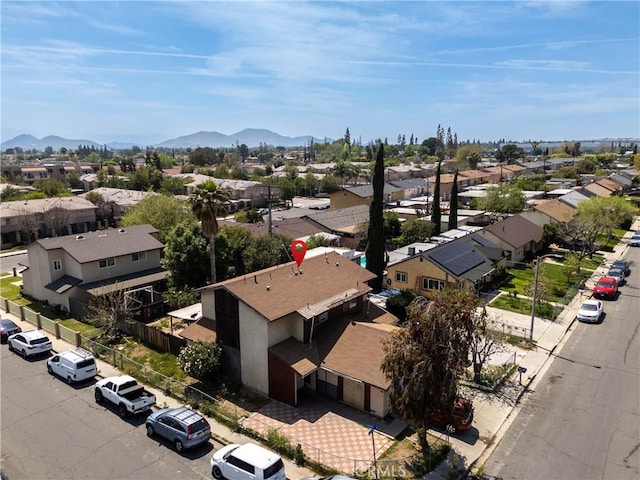 drone / aerial view with a mountain view and a residential view