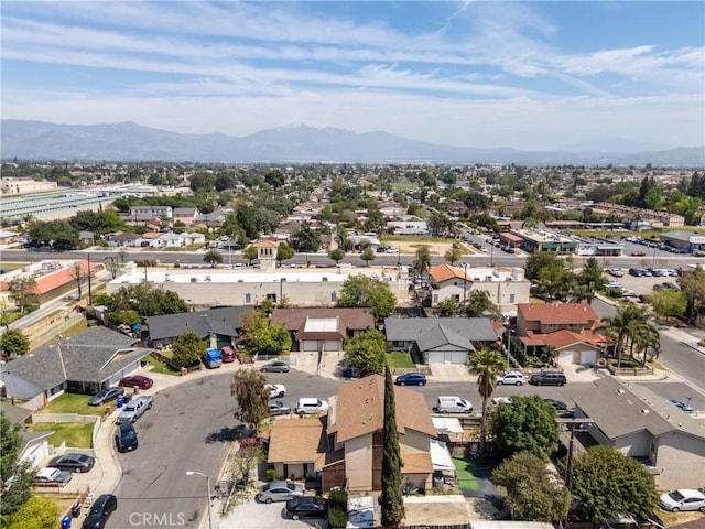 birds eye view of property featuring a mountain view and a residential view