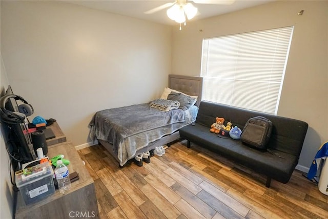 bedroom featuring ceiling fan and wood finished floors